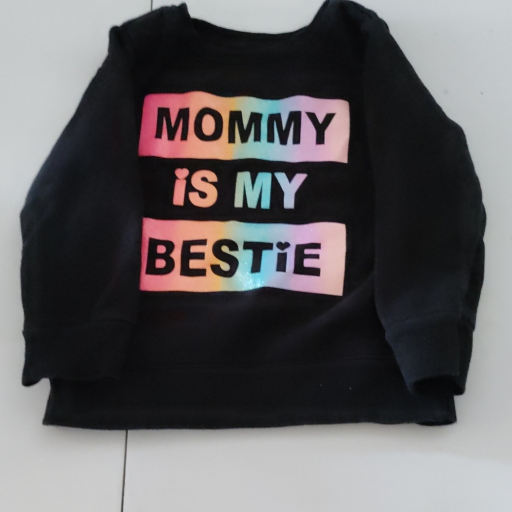 A black sweater that says my mommy is my bestie